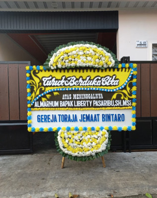 Papan Bunga Duka di Musaik
